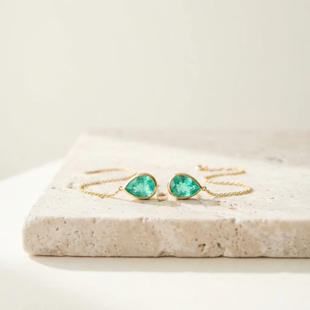 Pulseira de ouro com duas pedras em gota verde-água
